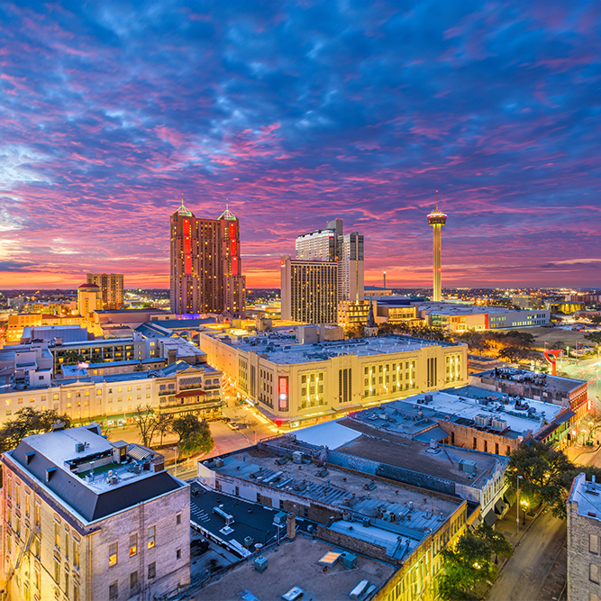 This overhead view captures the Henry B. González Convention Center and the sunset over San Antonio.