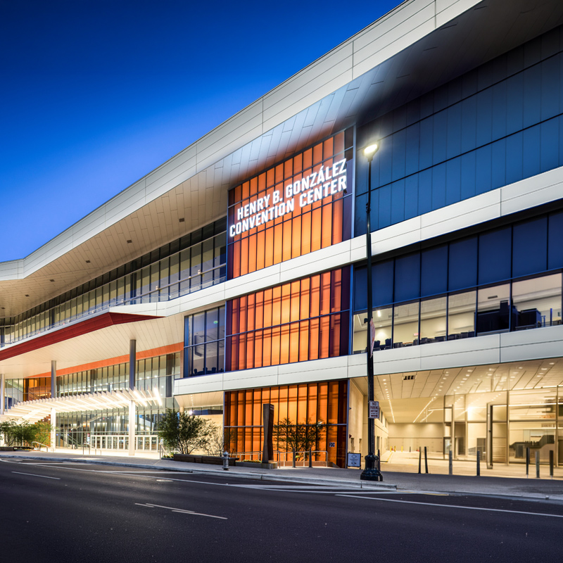This image depicts the front of the Henry B. González Convention Center inside a tile shape.