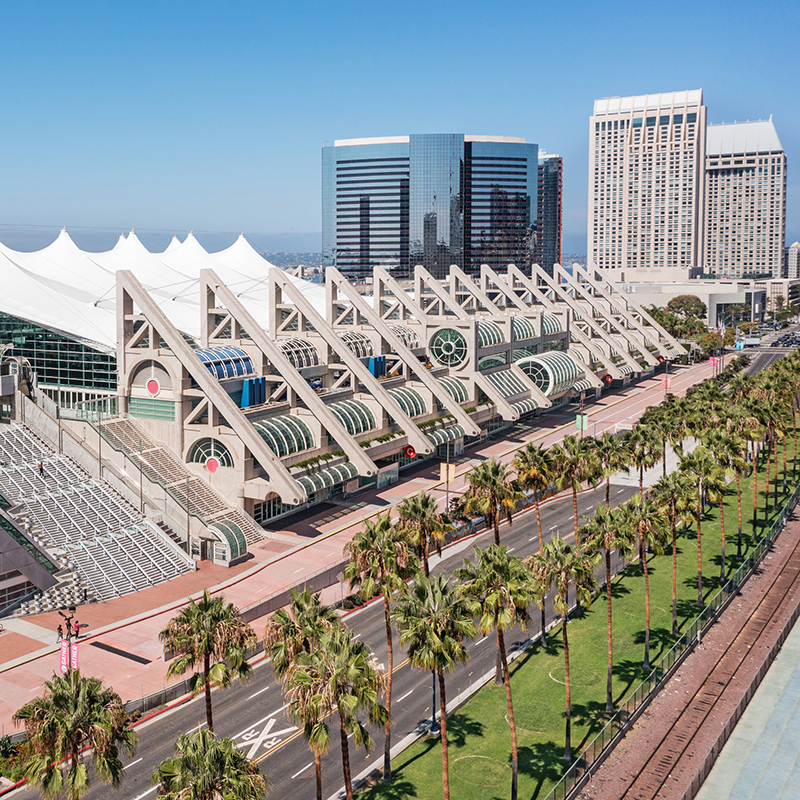 An aerial view of a portion of the San Diego Convention Center that shows the city side of the building, as well as the Sails Pavilion in the middle.