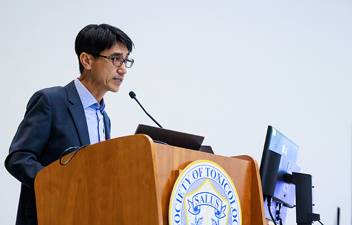 A presenter speaks at a podium at the SOT Annual Meeting.